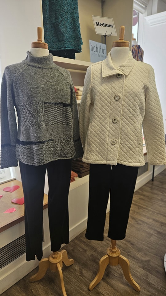 Textured turtleneck sweater and quilted jacket displayed on mannequins at Jorie's