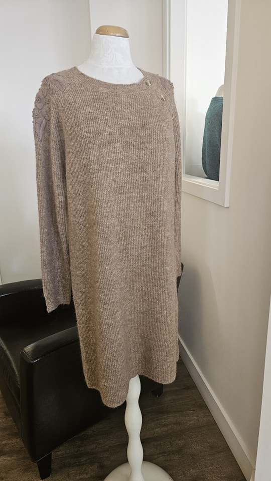 Taupe ribbed knit sweater dress on a mannequin at Jorie's