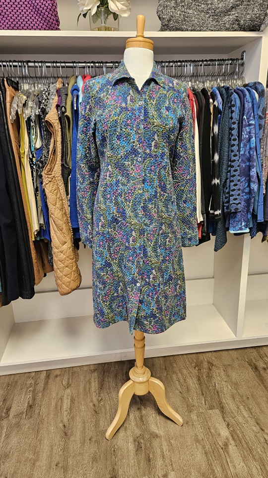 Blue and pink paisley print button-front coat on a mannequin