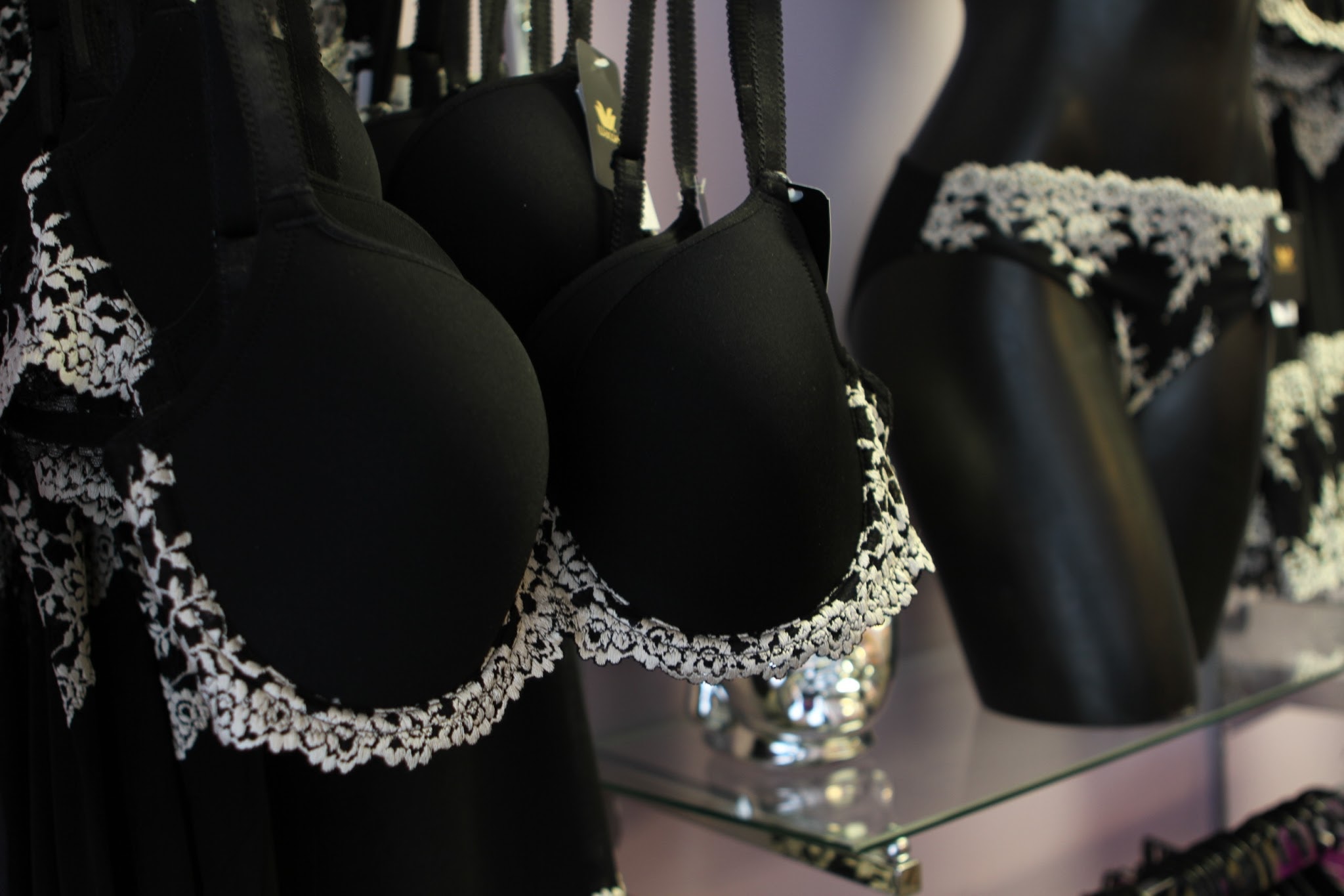 Lace-trimmed intimate apparel and accessories displayed at Jorie's Fine Clothing